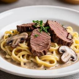 Exquisite Beef Stroganoff for San Francisco Corporate Events. A beautifully presented dish of classic beef stroganoff, perfect for a business lunch or dinner, showcasing authentic Russian flavors.