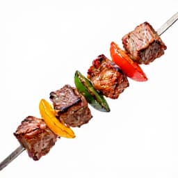 Grilled Armenian Shish Kebab. Succulent pieces of marinated meat and vegetables perfectly grilled on skewers, a signature dish at Beluga Restaurant & Banquet Hall.
