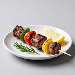 Exquisite Shish Kebab platter with authentic Armenian cuisine at Beluga Restaurant, San Francisco. Detailed view of grilled meats and fresh vegetables, showcasing culinary artistry.