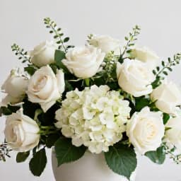 Elegant Decor at an Engagement Party Venue in San Francisco. A close-up of sophisticated table decorations, floral arrangements, and ambient lighting, reflecting the personalized service at Beluga.