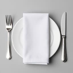 Elegant restaurant dining table setting in San Francisco. A beautifully set table with fine china, crystal glasses, and exquisite cutlery, ready for a luxurious dine-in experience at Beluga.