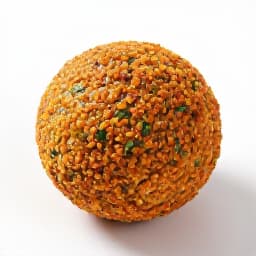 Close-up of freshly prepared Mediterranean falafel with vibrant herbs and a creamy sauce, showcasing the authentic flavors served at Beluga Restaurant in San Francisco.