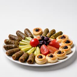 Professional chef preparing gourmet dishes for home party catering in San Francisco. A chef meticulously arranges authentic Russian, Armenian, or Mediterranean cuisine, highlighting the quality and presentation of Beluga
