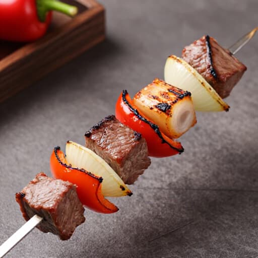 Exquisite Shish Kebab Platter from Beluga Restaurant San Francisco. A vibrant array of charcoal-grilled lamb, beef, and chicken shish kebabs, meticulously marinated and served with fluffy rice pilaf, fresh seasonal salad, and homemade sauces, showcasing authentic Armenian and Mediterranean flavors.