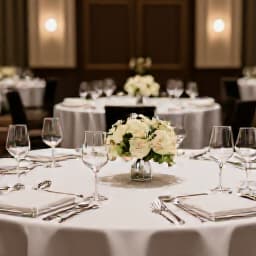 Professionals networking at a San Francisco corporate event banquet hall. Attendees engaged in discussion in an elegant venue, showcasing successful corporate event planning and venue booking expertise.